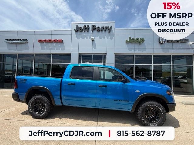 2026 RAM Ram 1500 RAM 1500 REBEL CREW CAB 4X4 5'7' BOX in Hydro Blue Pearl-Coat Exterior Paint — front three-quarter view